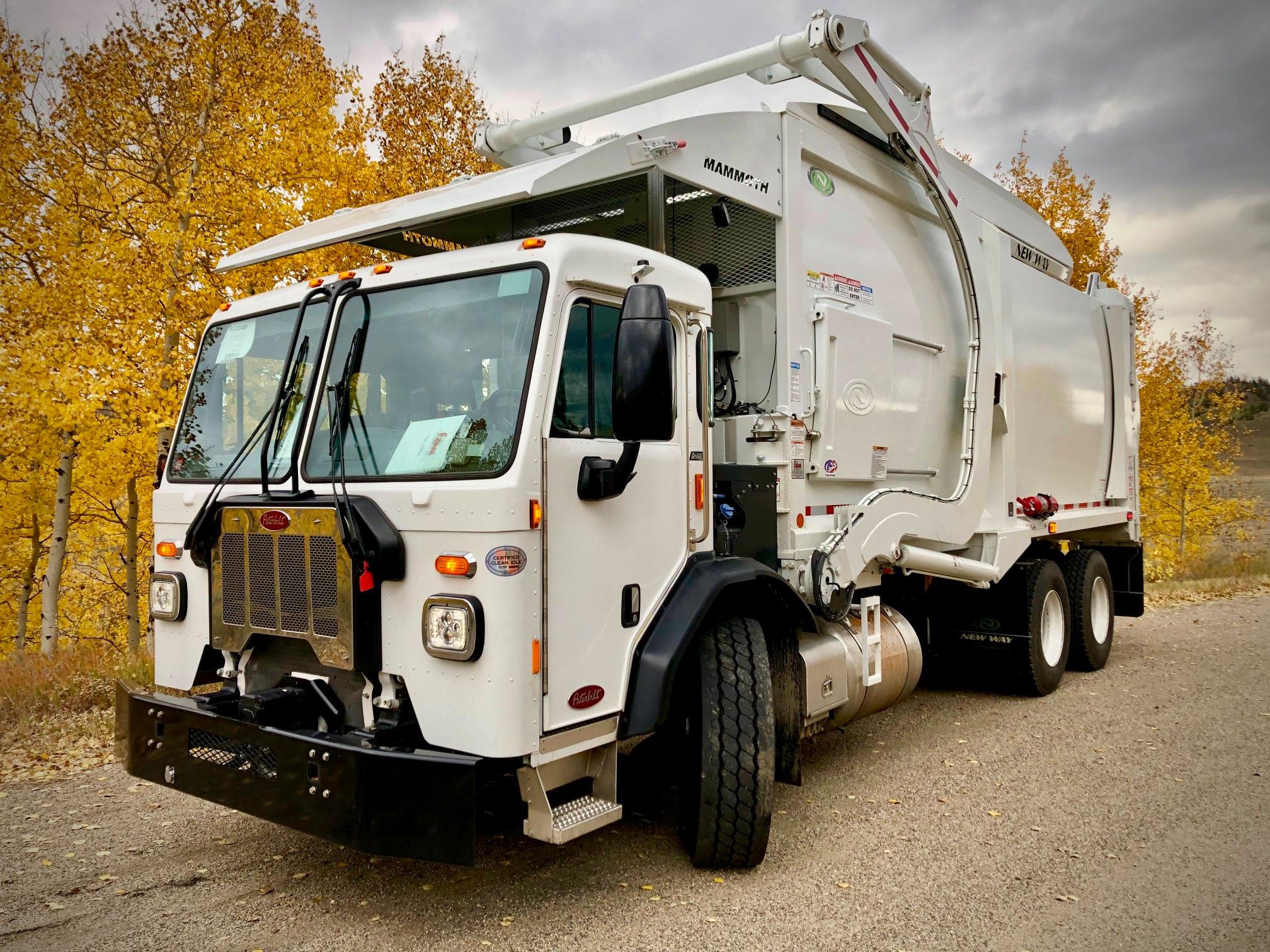 white garbage collection truck